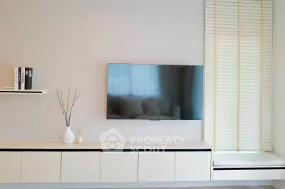 Modern living room with sleek TV setup and minimalist decor