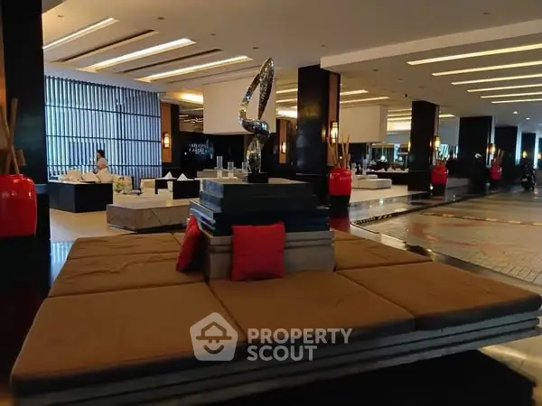Luxurious hotel lobby with modern decor and plush seating area