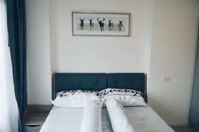 Cozy bedroom with stylish decor and natural light