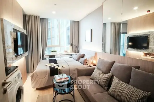 Modern studio apartment with cozy living area and stylish decor