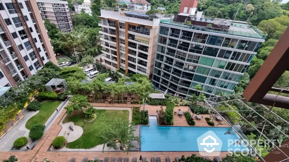 Luxurious condominium with pool and lush garden view