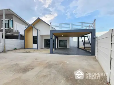 Modern two-story house with spacious driveway and rooftop terrace