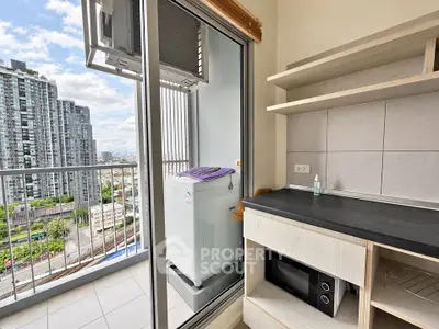Modern condo balcony with city view and compact kitchen appliances