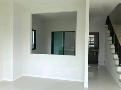 Modern minimalist interior with open layout and staircase
