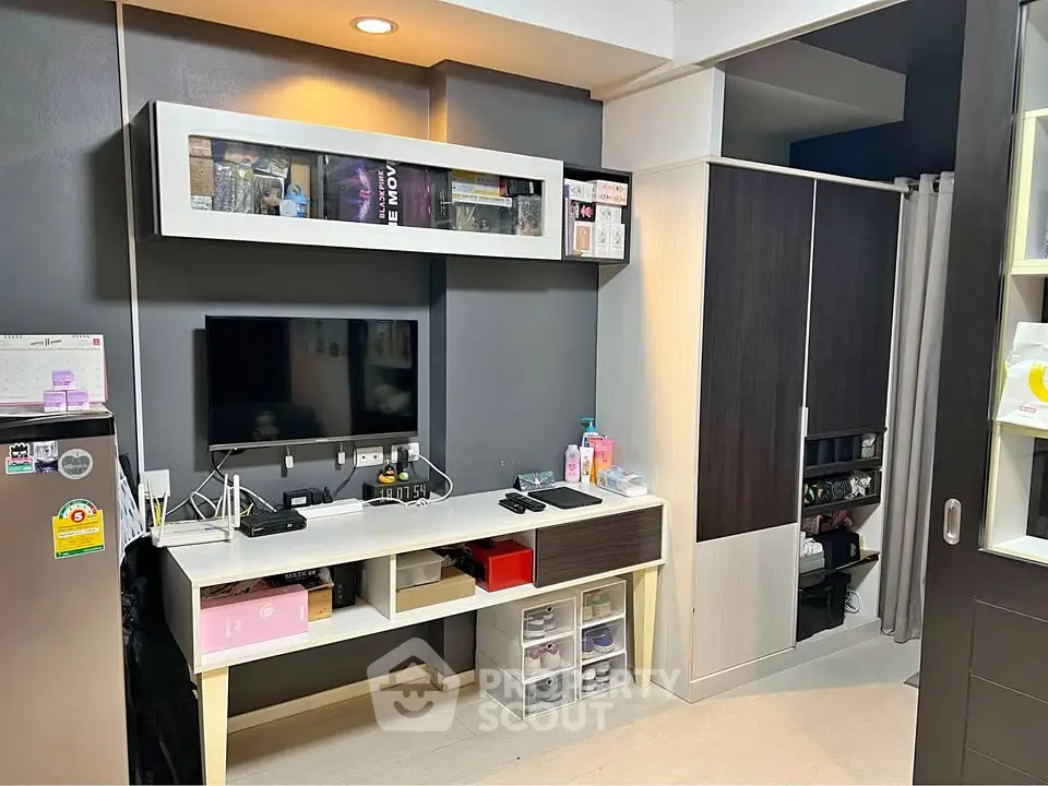 Modern study room with sleek storage and entertainment setup