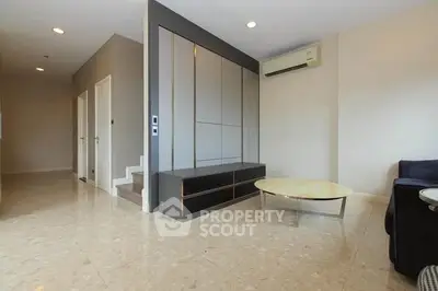 Spacious modern living room with sleek design and air conditioning