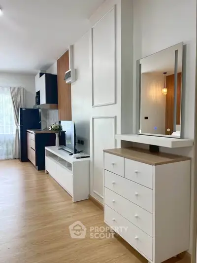 Modern living room with stylish furniture and open kitchen layout