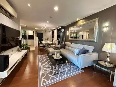 Luxurious living room with elegant decor, spacious seating, and modern lighting in a stylish apartment.