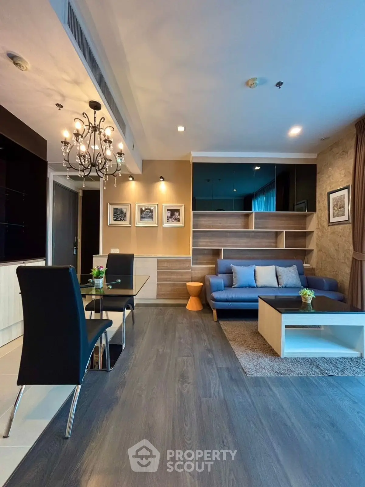 Modern living room with elegant chandelier and stylish decor