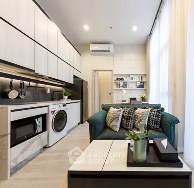 Modern open-layout living room with stylish kitchen and cozy seating area, perfect for urban living.