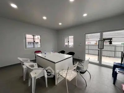 Modern office space with minimalist design and ample natural light