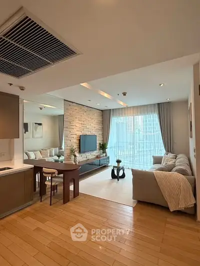 Spacious modern living room with elegant decor and large windows