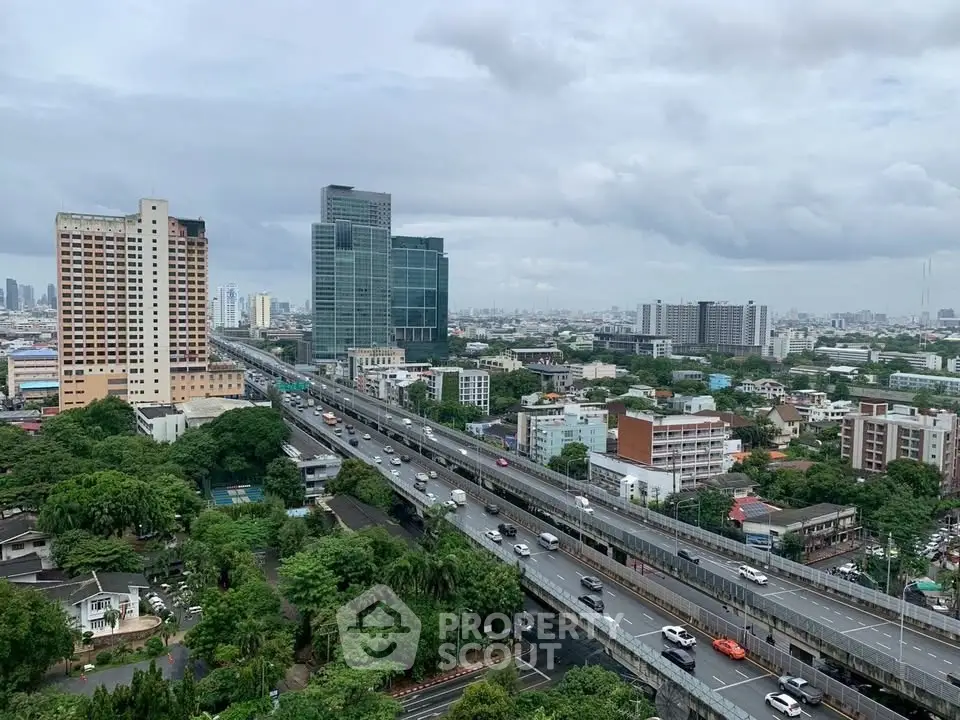 Stunning cityscape view with modern high-rise buildings and lush greenery, perfect for urban living.