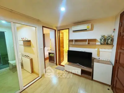 Cozy living room with modern decor and air conditioning in a compact apartment