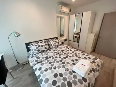 Modern bedroom with stylish decor and ample storage space