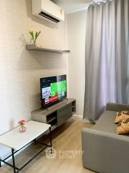 Cozy living room with modern decor and wall-mounted TV