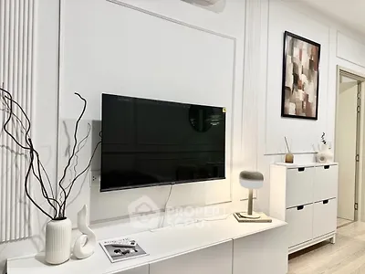 Modern living room with wall-mounted TV and stylish decor
