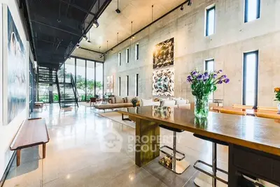 Stunning modern living room with high ceilings and artistic decor