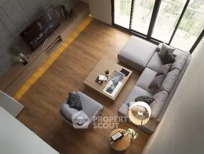 Spacious modern living room with stylish furniture and large windows.