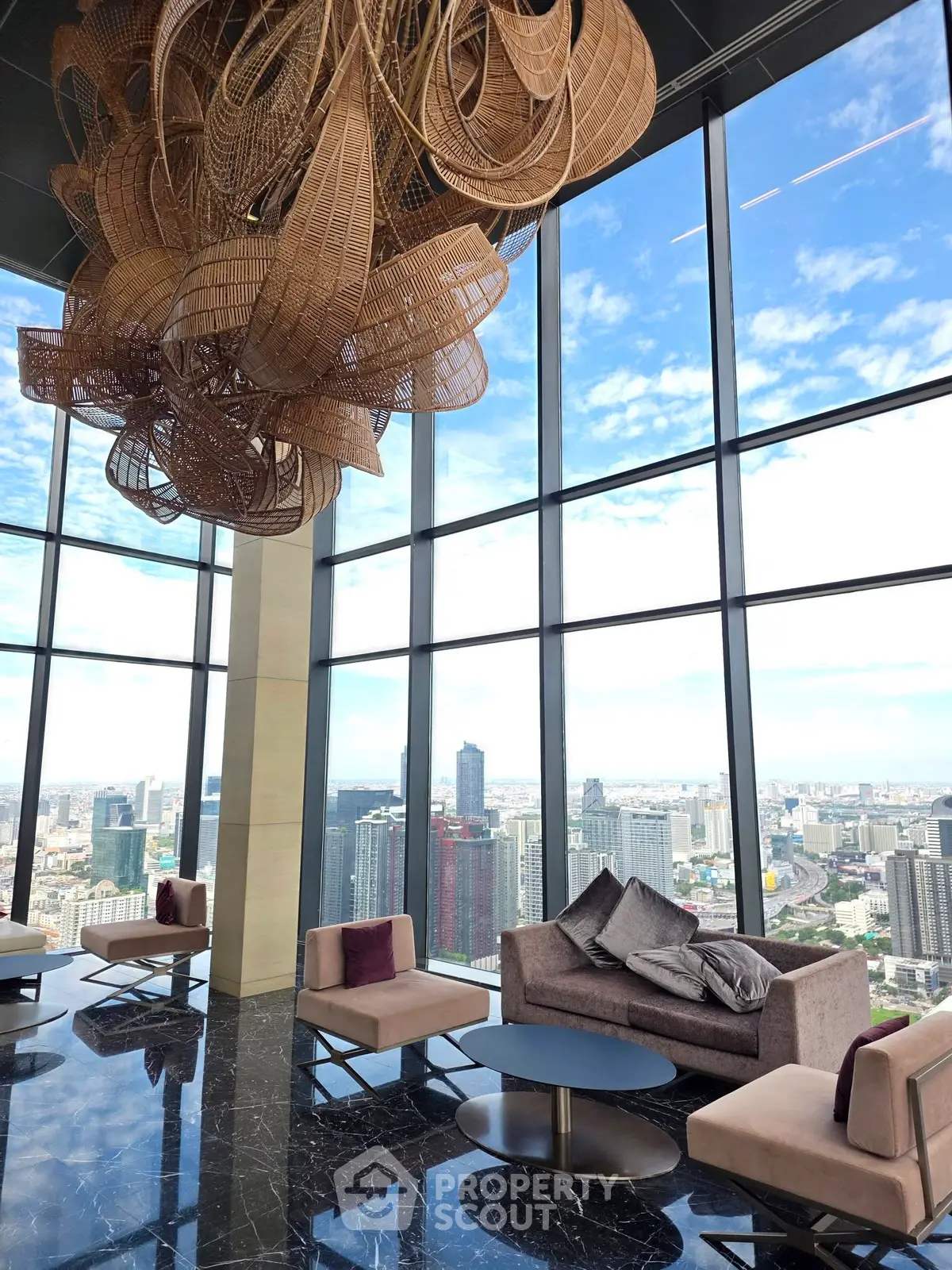 Luxurious high-rise lounge with panoramic city views and elegant decor