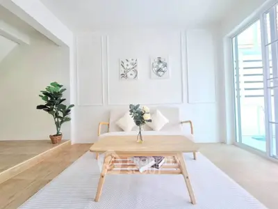 Bright minimalist living room with modern decor and natural light