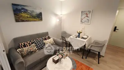 Cozy living room with modern decor and dining area, perfect for relaxation and entertaining.