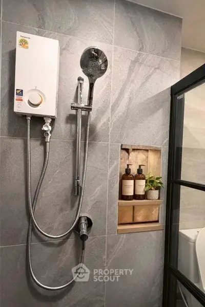 Modern bathroom with sleek shower and stylish built-in shelf