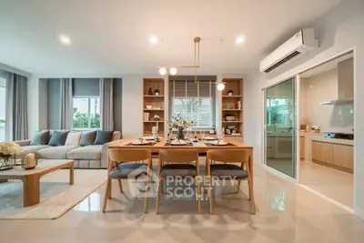 Spacious modern living and dining area with elegant decor and natural light.