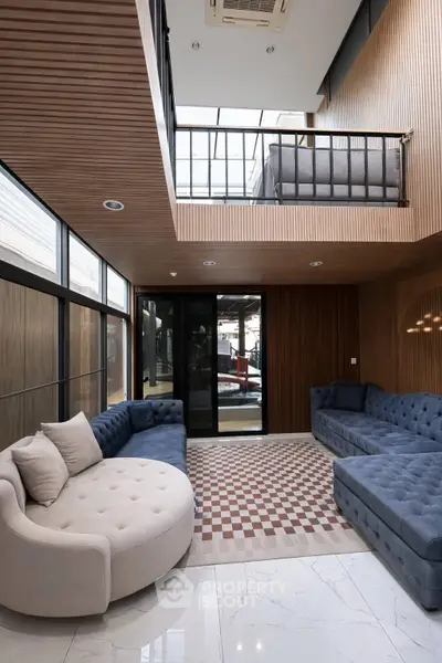 Luxurious modern living room with high ceiling and stylish furniture