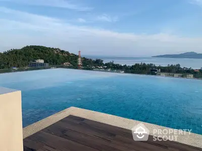 Stunning rooftop infinity pool with breathtaking ocean view and serene surroundings.