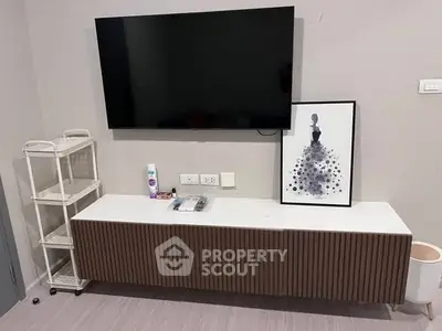 Modern living room with wall-mounted TV and stylish console table