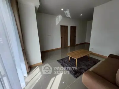 Spacious living room with modern furniture and natural light