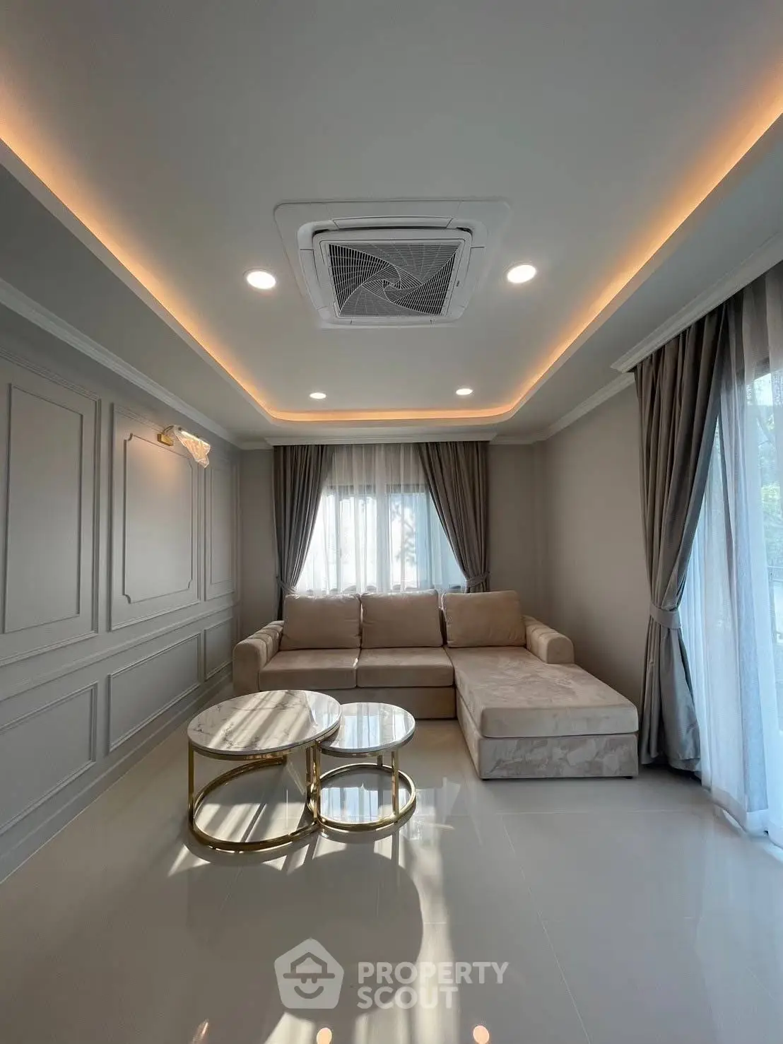 Luxurious living room with elegant sofa and modern ceiling lighting