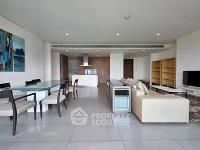 Spacious modern living room with open kitchen and elegant dining area