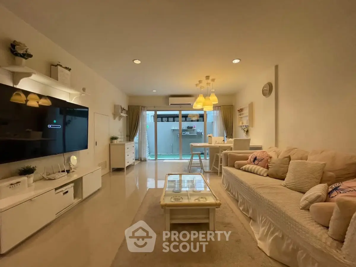 Spacious living room with modern decor and cozy seating area