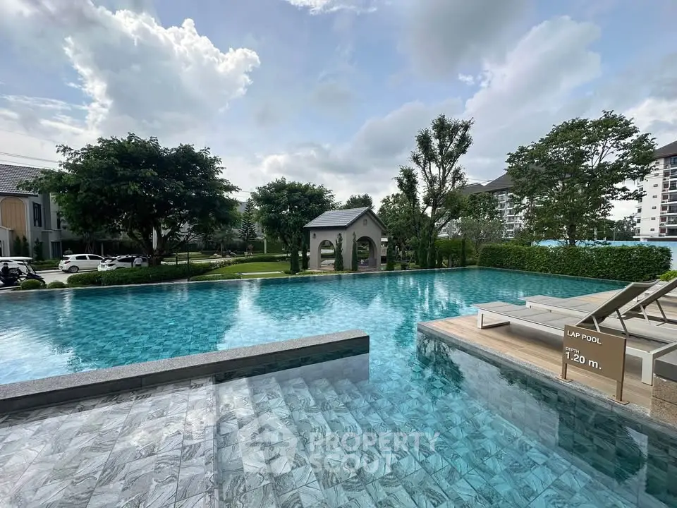 Luxurious outdoor pool area with serene surroundings and modern design, perfect for relaxation and leisure.
