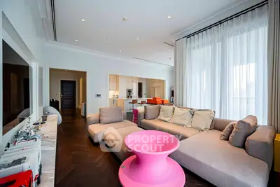 Luxurious modern living room with stylish furniture and open kitchen layout