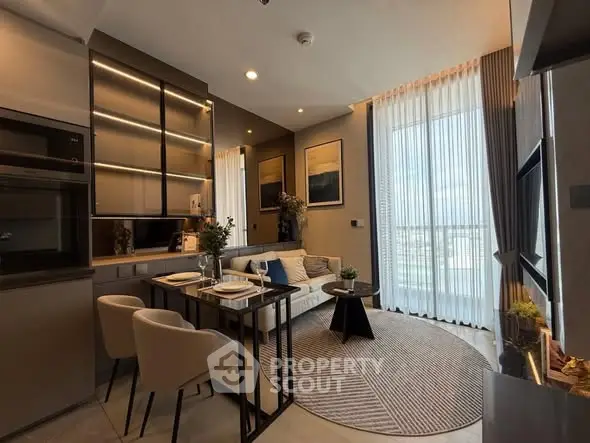 Modern living room with elegant decor and large window offering natural light