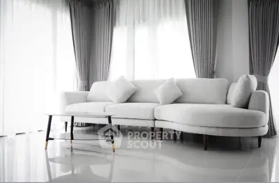 Elegant modern living room with stylish white sofa and chic curtains