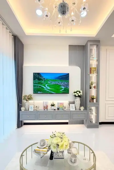 Luxurious living room with elegant decor and modern entertainment setup