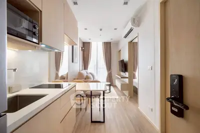 Modern open-plan kitchen and living room with sleek design and natural light