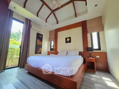 Luxurious bedroom with high ceiling and modern decor in a serene setting