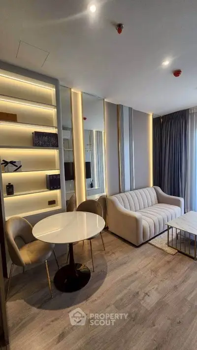 Modern living room with elegant sofa and stylish lighting in a contemporary apartment.