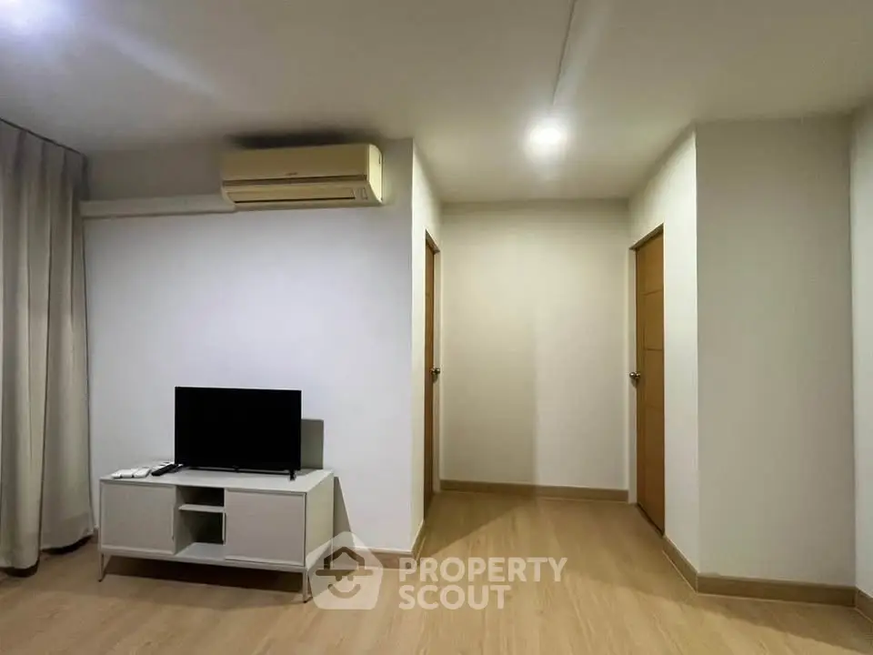 Modern living room with minimalist decor and air conditioning