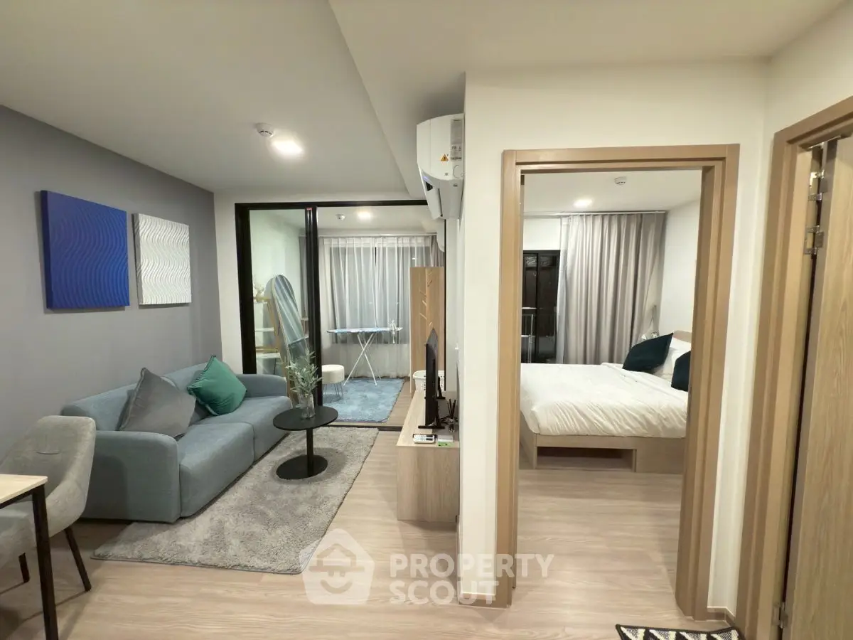 Modern apartment interior with cozy living room and stylish bedroom, featuring contemporary decor and open layout.