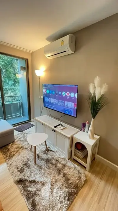 Cozy living room with modern decor and balcony view