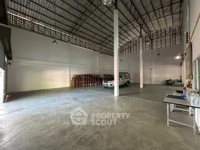 Spacious industrial warehouse with high ceilings and ample storage space