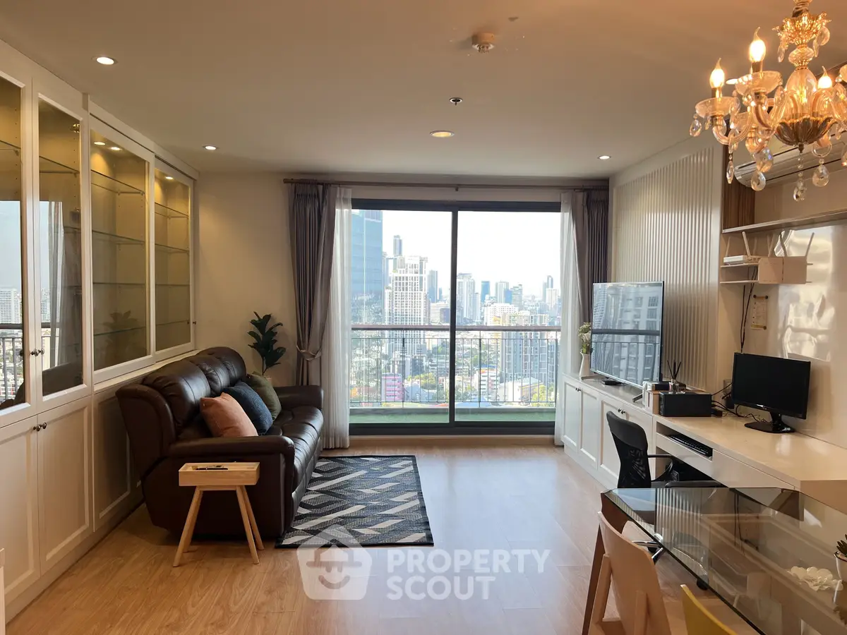 Luxurious living room with stunning city view and elegant chandelier