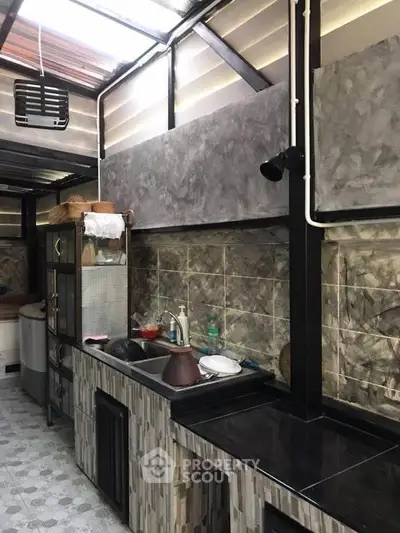 Charming rustic kitchen with open layout and modern finishes, perfect for culinary enthusiasts.