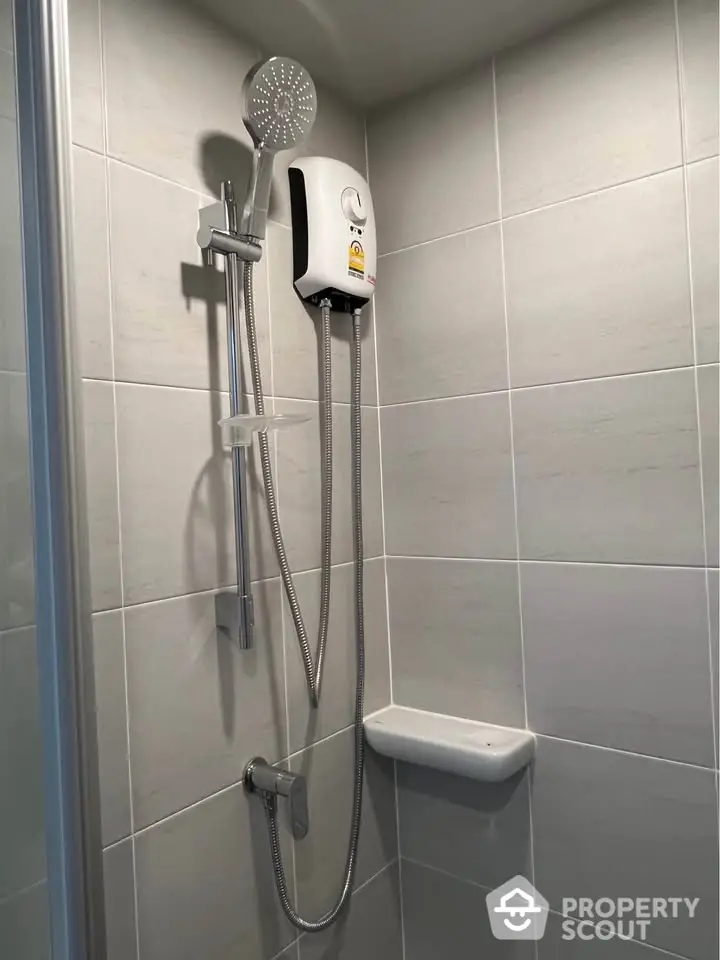 Modern bathroom with sleek shower fixtures and tiled walls